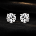 Blacknest Vault diamond stud earrings on black velvet