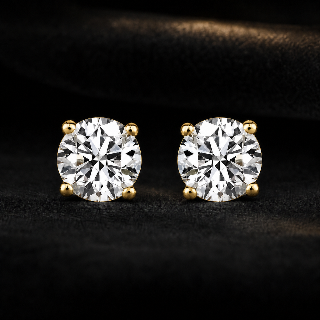 Blacknest Vault yellow gold diamond stud earrings on black velvet
