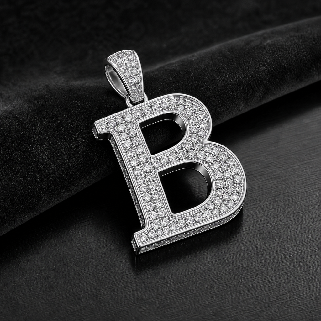 Blacknest Vault white gold or platinum initial pendant on black velvet